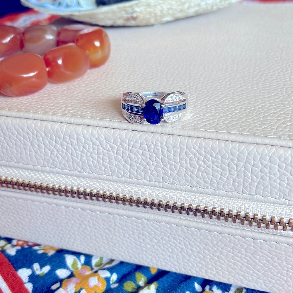 Ornate sterling, diamond, and sapphire ring